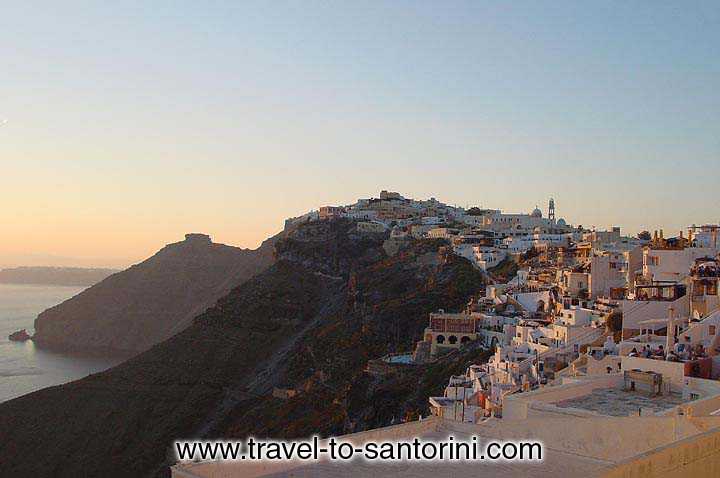 Fira and Skaros in the afternoon sunset light.
It is the best possible time to spend with a coffee or a drink at the caldera rim.  